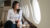 woman looking out plane window